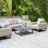 Beige outdoor garden sofa set with metal coffee table and cushions on a patio