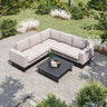 Outdoor corner sofa with beige cushions and black coffee table on stone patio
