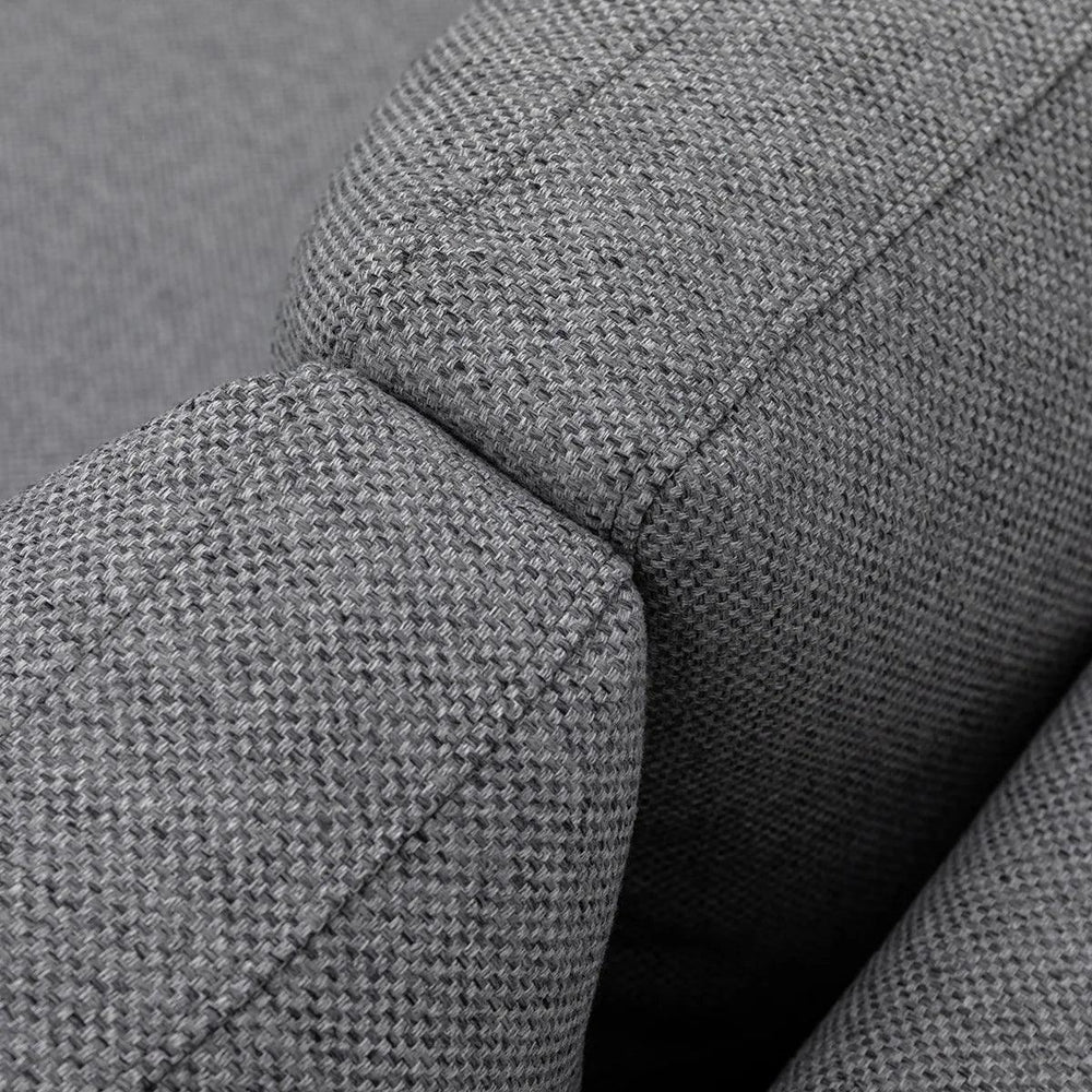 Closeup of grey fabric sofa arm with textured upholstery and stitching detail