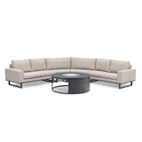 Beige corner sofa set with black metal legs and round outdoor fire pit table
