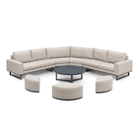 Outdoor corner sofa set with beige cushions, round coffee table and curved stools