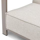 Close-up of beige fabric sofa cushion with metal frame corner detail