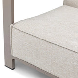Closeup of beige fabric sofa seat cushion with modern metal frame corner