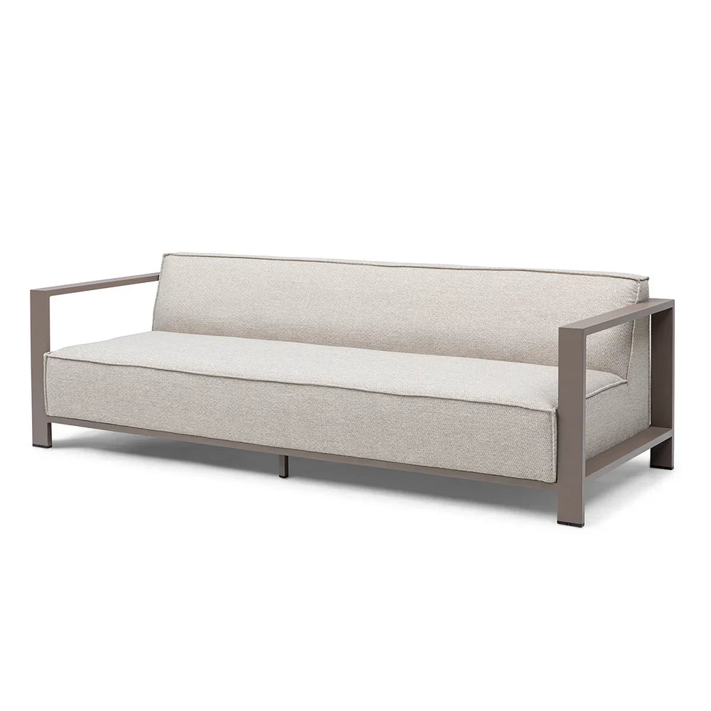 Beige three-seater sofa with metal arms and minimalist design on white background