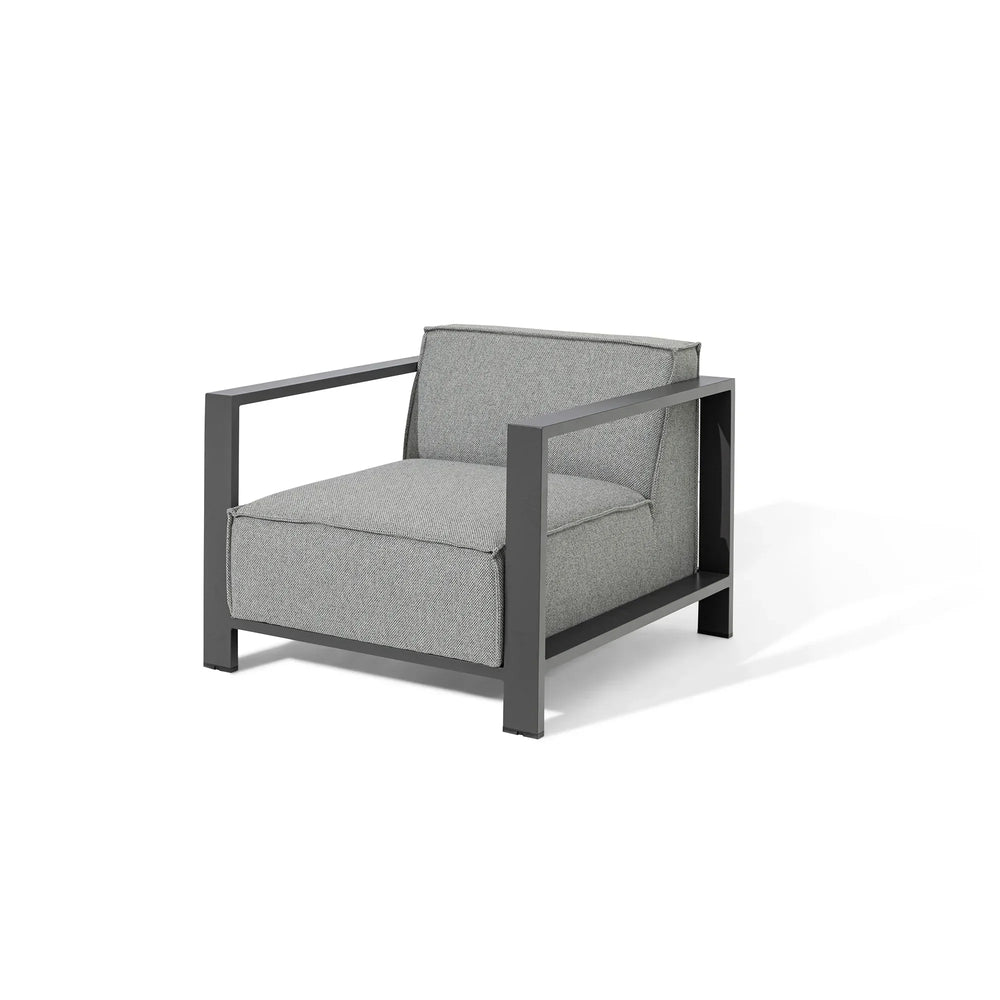 Grey armchair with metal frame and fabric cushions, modern minimalist design, angled view