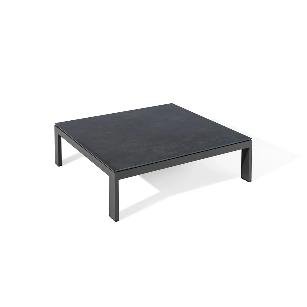 Square black coffee table with metal frame and dark tabletop on white background