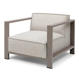 Beige fabric armchair with taupe metal frame and boxy cushions, front angled view