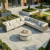 Beige outdoor corner sofa set with cushions and round coffee table on patio