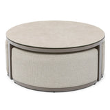Round beige coffee table with cushioned base and smooth stone-effect top