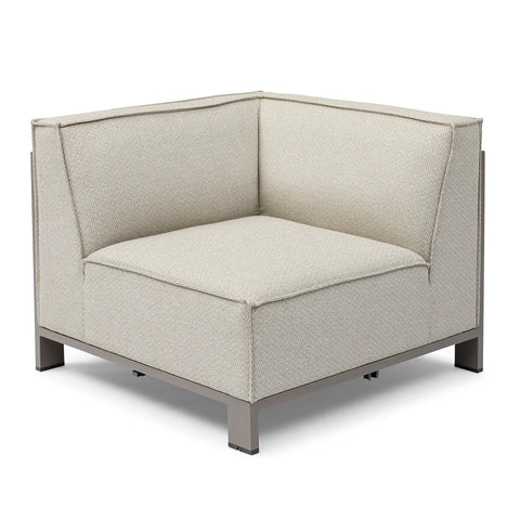 Modern corner sofa section with beige fabric upholstery and metal base, angled view