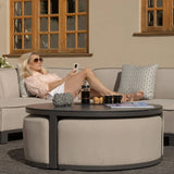 Outdoor corner sofa set with round coffee table and cushions on patio