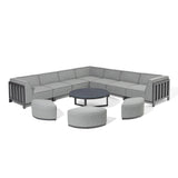 Grey corner outdoor sofa set with round coffee table and matching curved stools