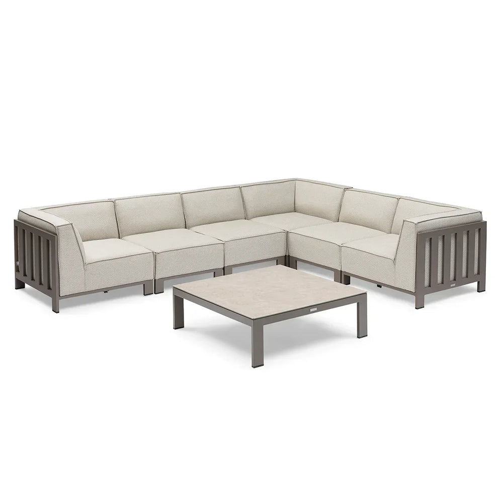 Beige outdoor corner sofa set with metal frame and matching low coffee table