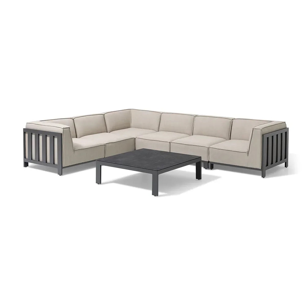 Beige outdoor corner sofa set with black metal frame and low square coffee table