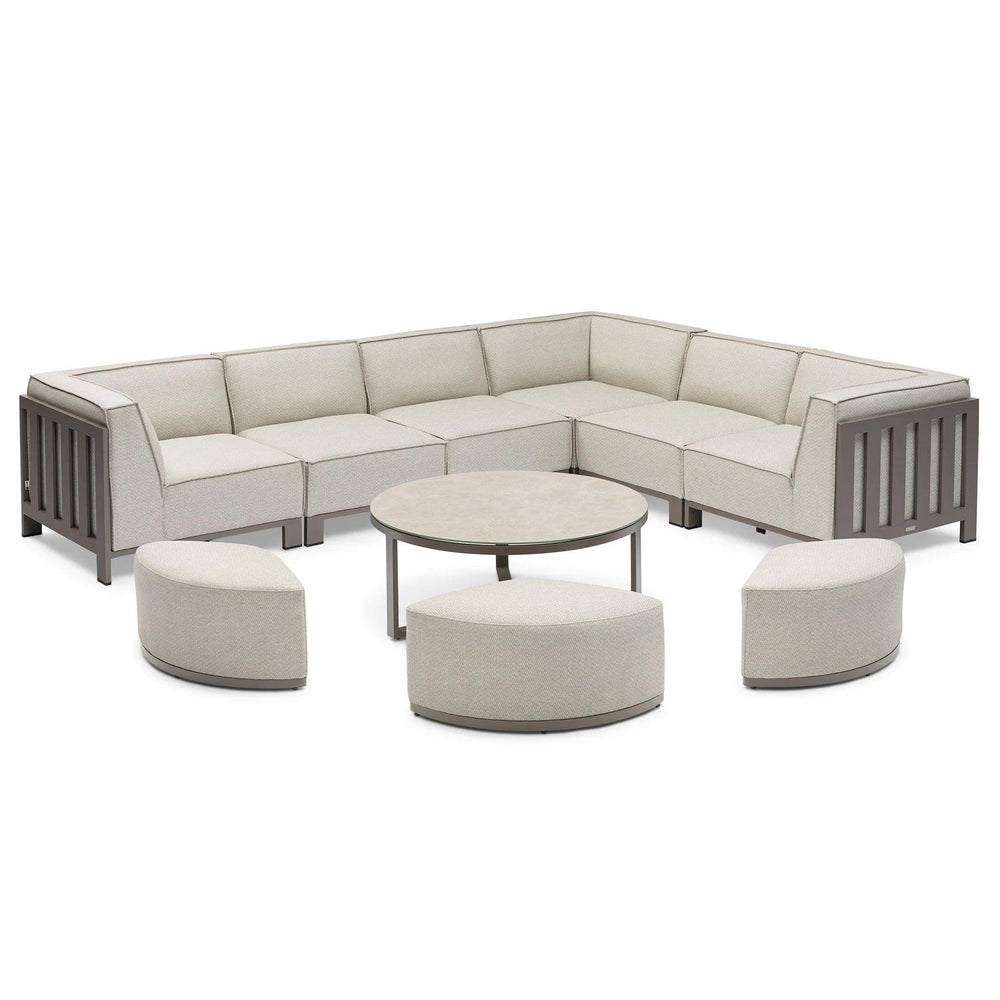 Beige outdoor corner sofa set with metal frame, three curved stools, and round coffee table