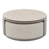 Round coffee table with light stone top and textured beige upholstered base