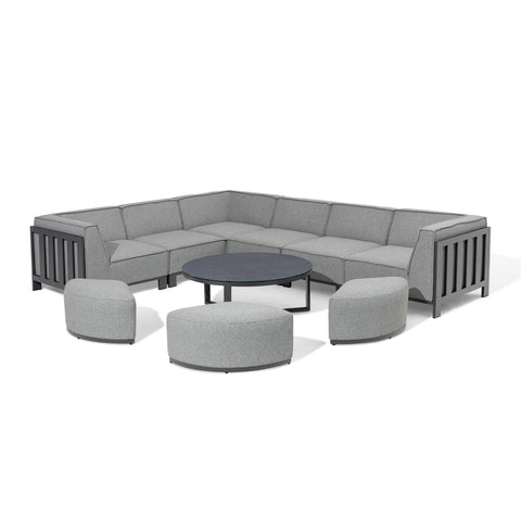 Grey corner sofa set with metal frame, round coffee table and three matching pouffes