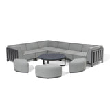 Grey corner sofa set with metal frame, round coffee table and three matching pouffes