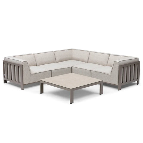 Beige corner sofa set with metal frame and low square coffee table on white background