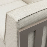 Close-up of outdoor sofa armrest in beige woven fabric with taupe aluminum frame