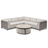 Beige fabric corner sofa with metal frame and round coffee table on white background
