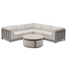 Beige fabric corner sofa with metal frame and round coffee table on white background