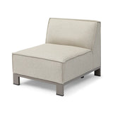 Beige armless lounge chair with textured fabric upholstery and metal legs