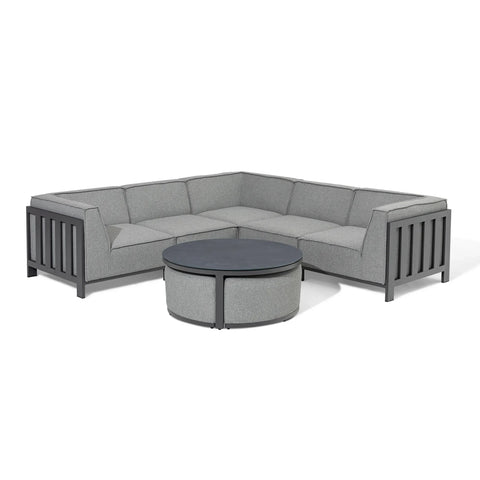 Grey corner outdoor sofa set with matching round coffee table on white background