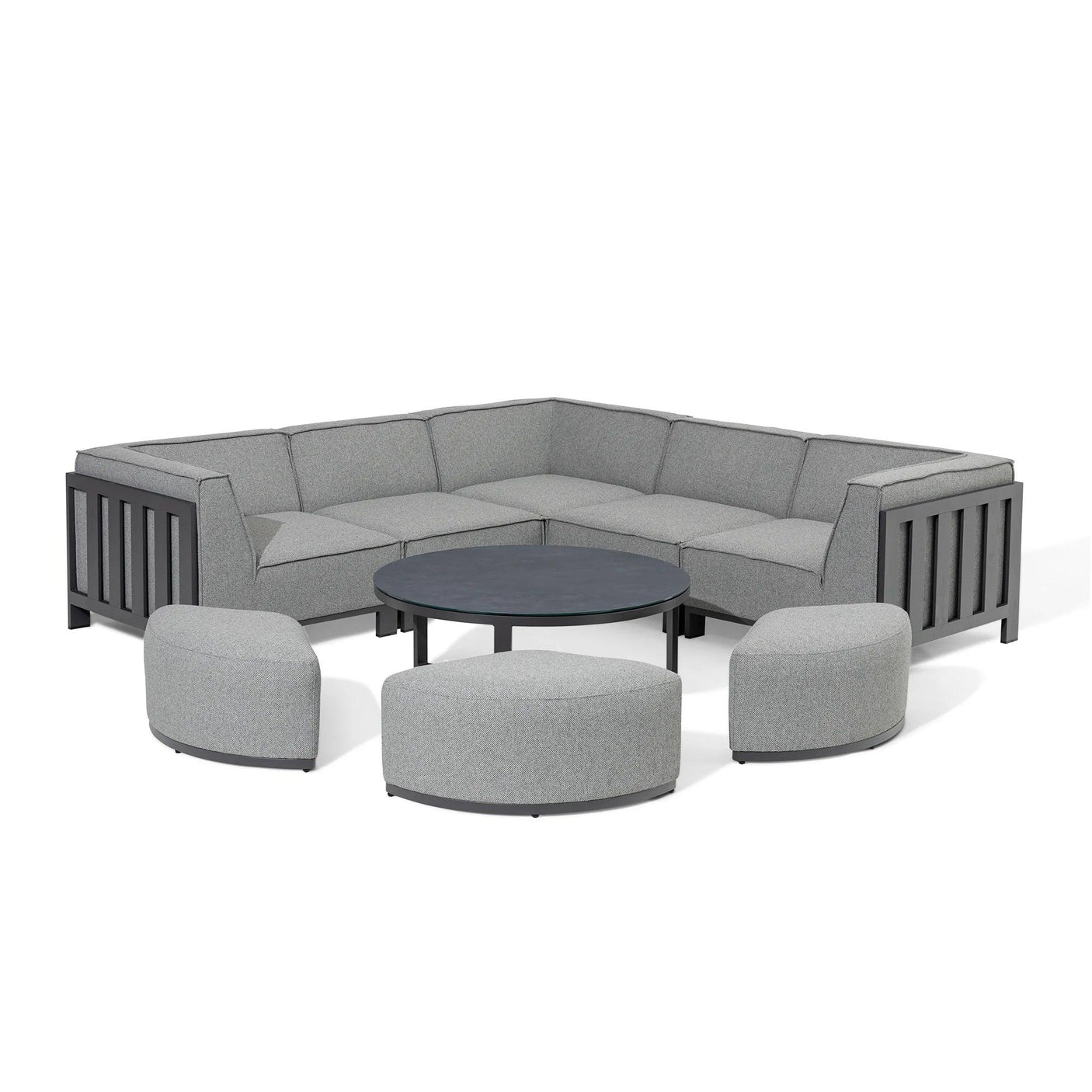 Grey outdoor corner sofa set with three matching stools and a round coffee table