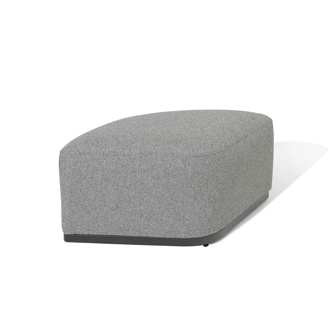 Grey fabric ottoman with curved edges and black base on white background