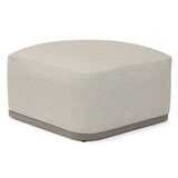 Light grey fabric ottoman with rounded edges and a sturdy base, corner angle view