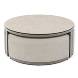 Round coffee table with light stone top and fabric upholstered base in neutral tones