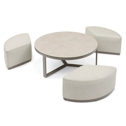 Beige upholstered curved stools with round coffee table and metal legs, modern furniture set