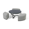 Round coffee table with black top and three curved grey fabric stools grouped around