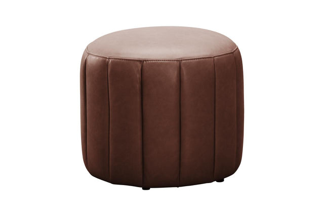 A round brown faux leather ottoman with vertical channel tufting on a solid white background.
