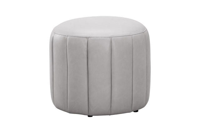 A round, light gray upholstered ottoman with vertical channel tufting, shown against a plain white background.