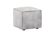 A square ottoman with a light gray faux leather or suede-like finish, featuring stitched panel details and small black feet, shown on a plain white background.
