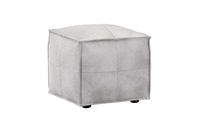A square ottoman with a light gray faux leather or suede-like finish, featuring stitched panel details and small black feet, shown on a plain white background.