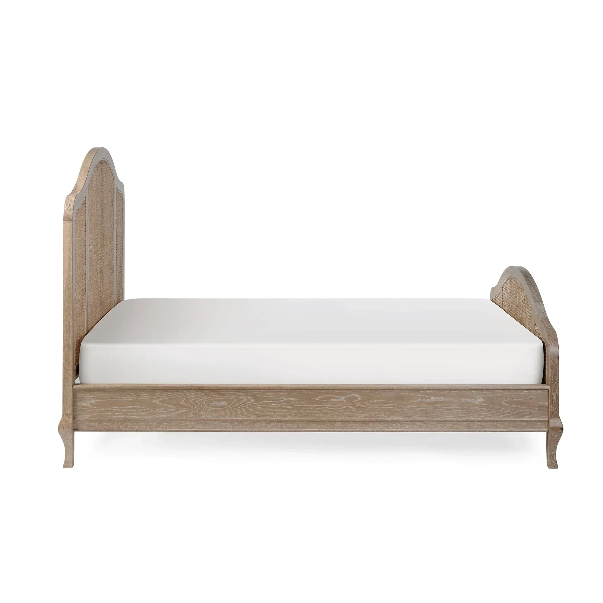 Wooden bed frame with rattan headboard and footboard, side view, white mattress on top