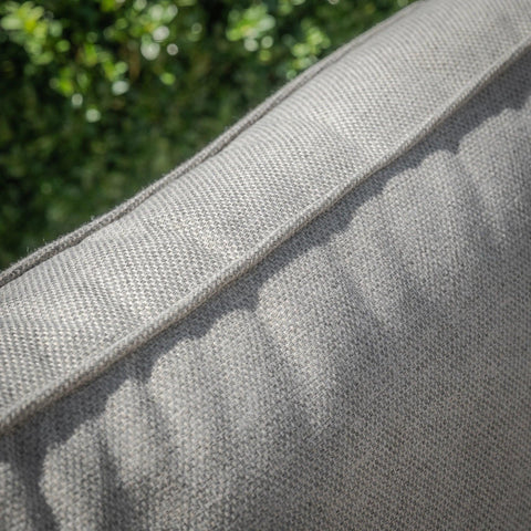 Close-up of grey outdoor sofa cushion fabric and stitching detail
