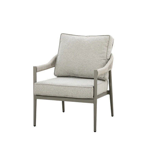 Light grey upholstered armchair with slim metal frame and cushions on white background