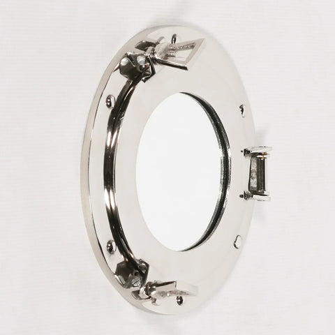 Round porthole wall mirror with polished chrome frame and secure hinge detail