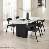 Six black wooden dining chairs with curved backs around white oval table in bright room with large window.