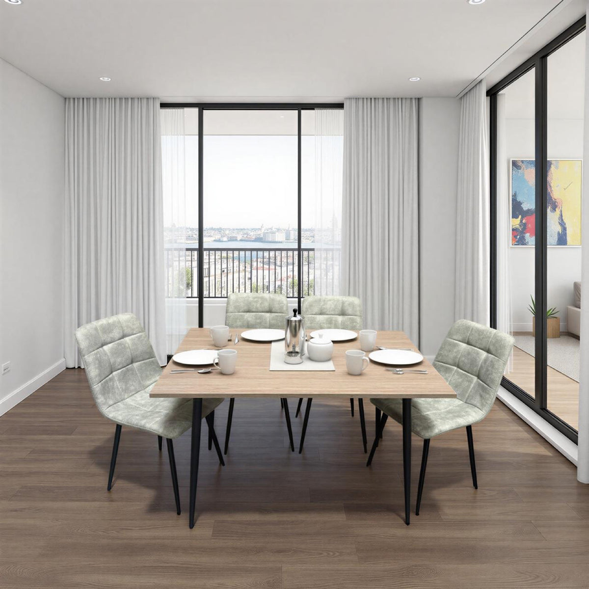 Dining area with a wooden table and chairs in a modern room with large windows.