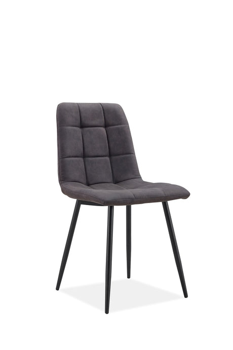A modern dining chair upholstered in dark gray tufted velvet with slim black metal legs, shown against a plain white background.