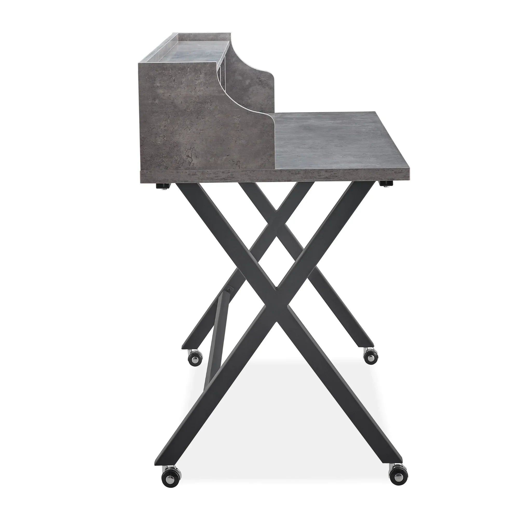 Grey office desk with raised shelf, metal X-frame legs, and wheels, side view