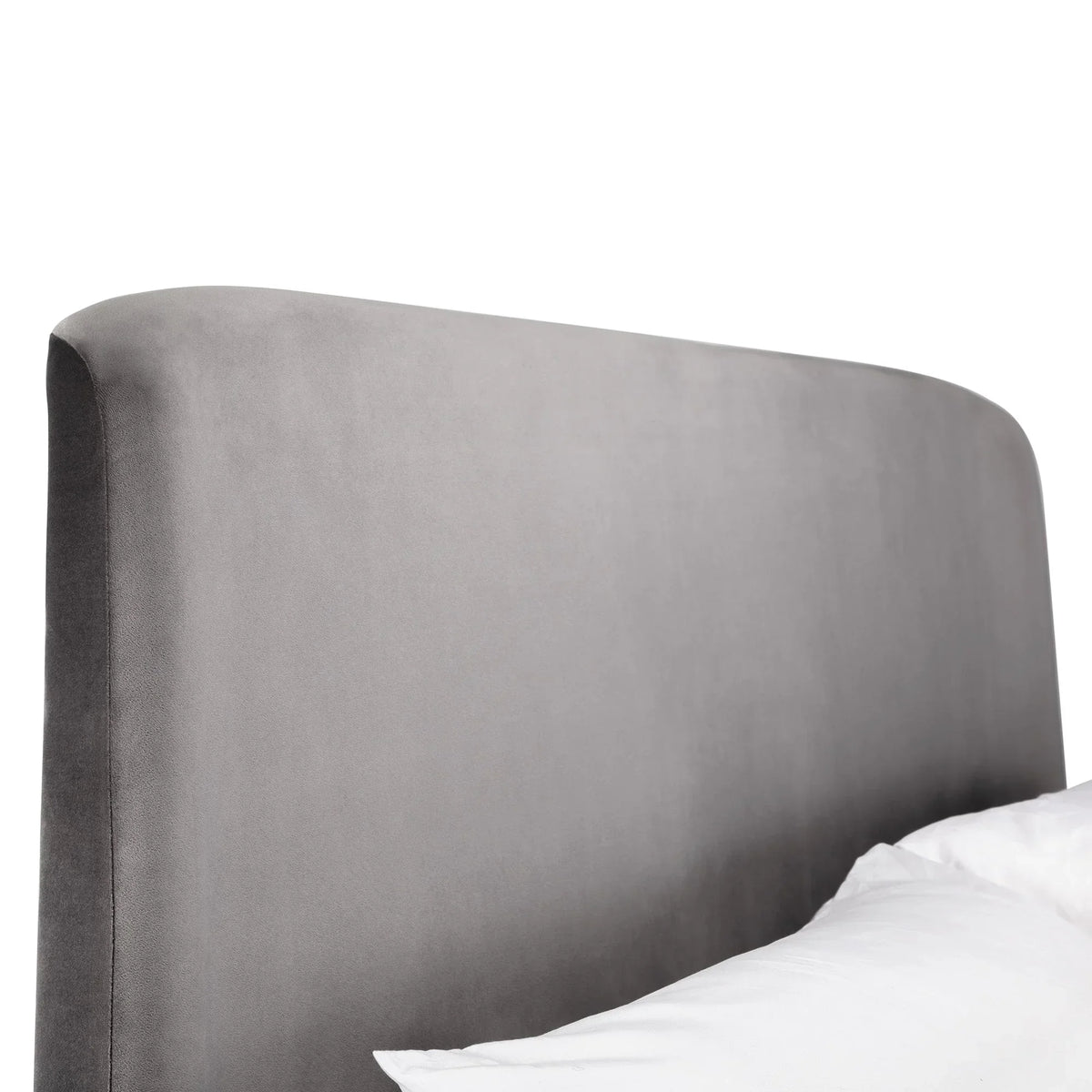 Grey ottoman storage bed with upholstered headboard, close-up angle