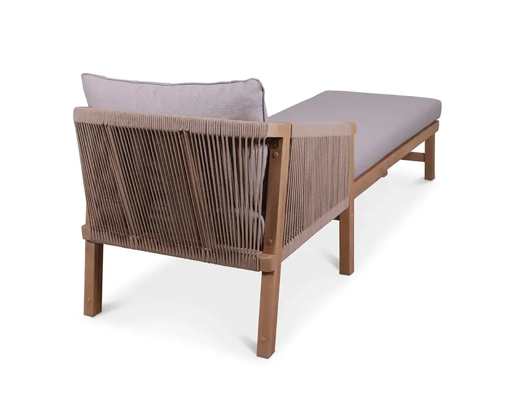 Outdoor wooden sun lounger with rope backrest and grey seat cushion, angled rear view