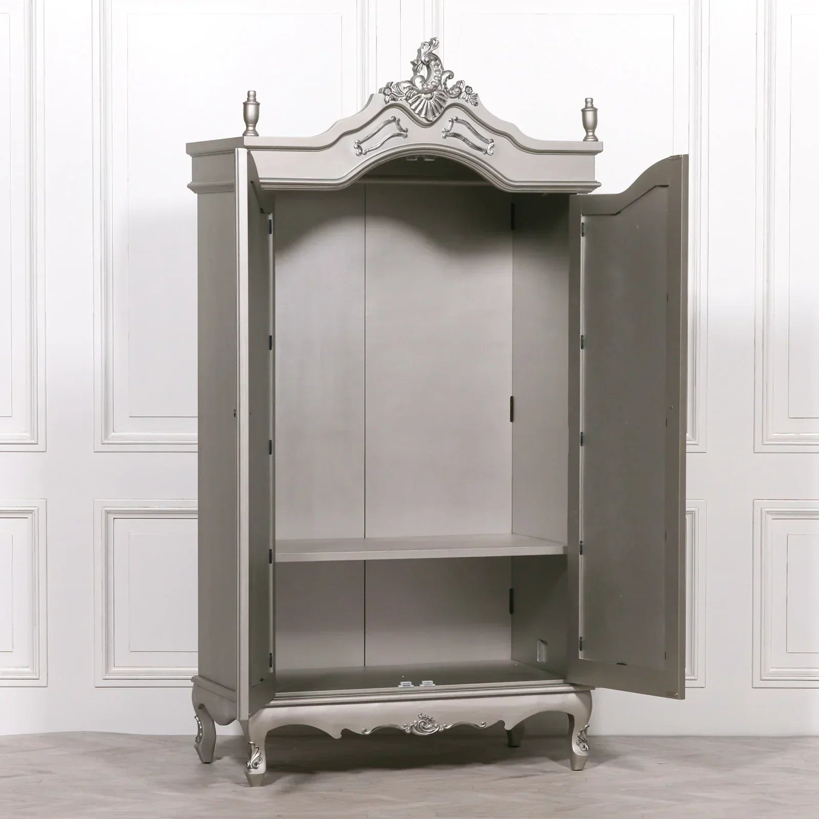 Grey wooden wardrobe with ornate detailing, open double doors, single internal shelf