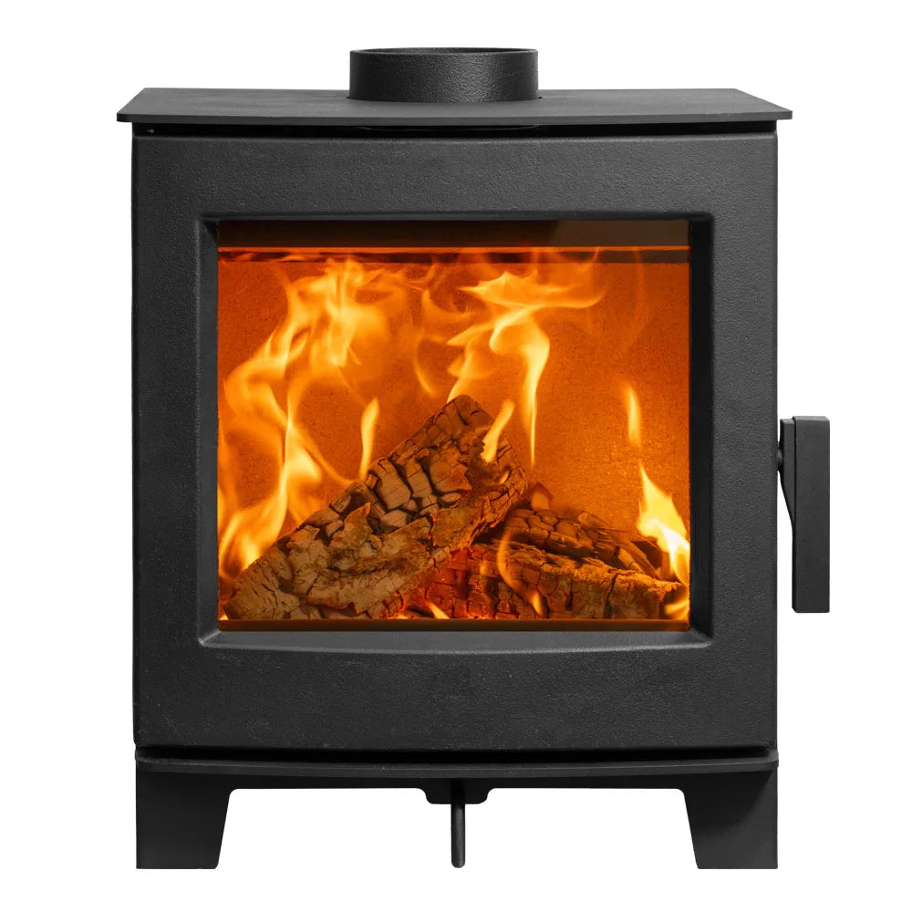Wood burning stove with a large glass front displaying a vibrant fire and logs inside.